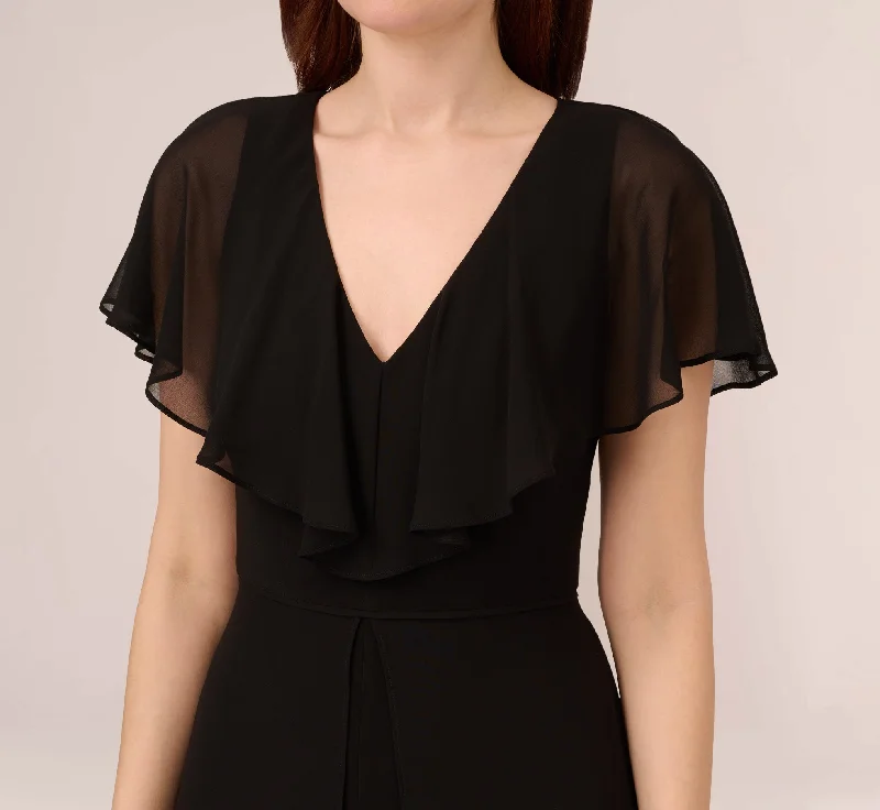 jersey-jumpsuit-with-chiffon-capelet-and-skirt-overlay-in-black-ap1d104868