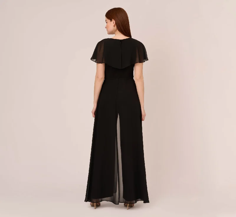 jersey-jumpsuit-with-chiffon-capelet-and-skirt-overlay-in-black-ap1d104868